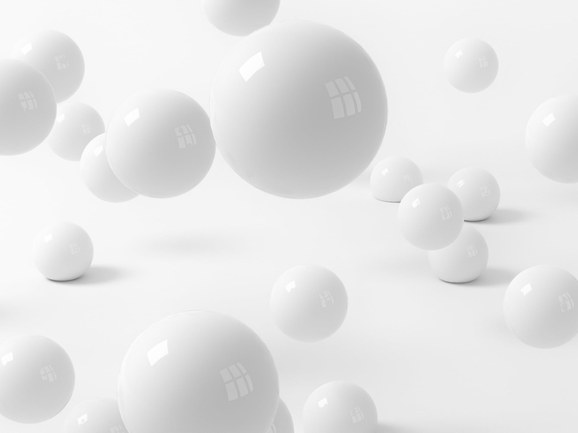 White balls falling on to a white floor