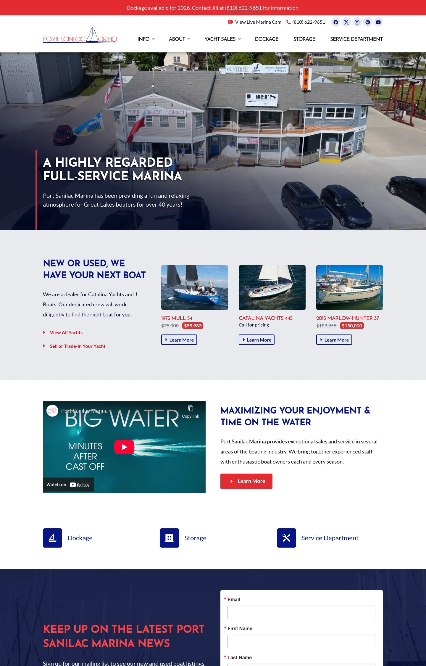 A homepage screenshot of a website designed for Port Sanilac Marina, featuring an aerial photo of the marina building, advertising itself as a highly regarded full-service marina.